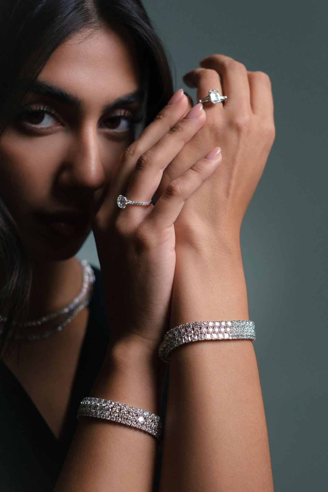 Model wearing Soit Belle natural diamond solitaire engagement rings
