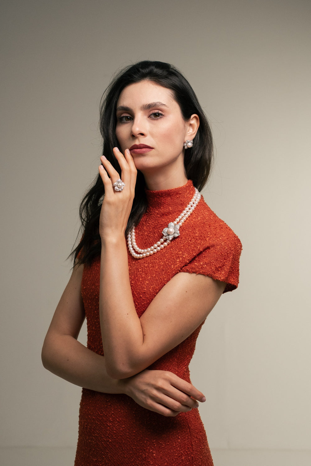 Model wearing Soit Belle Bahr pearl and diamond necklace, earrings and ring