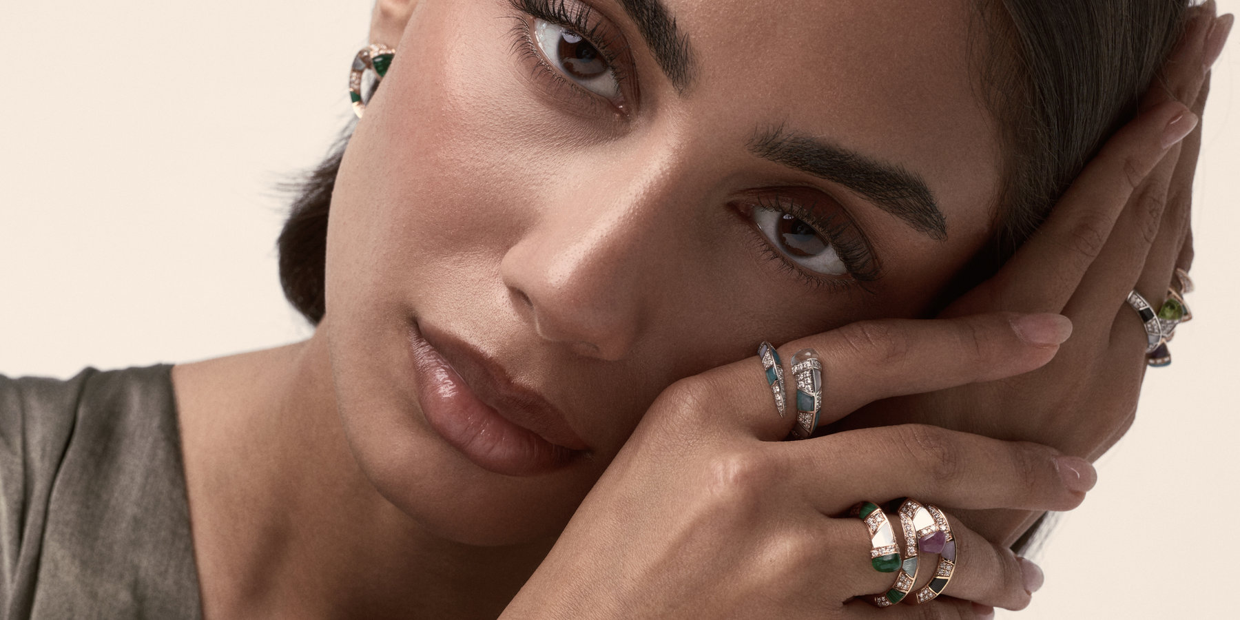Model wearing Soit Belle Artistry diamond bangles and rings with natural gemstones