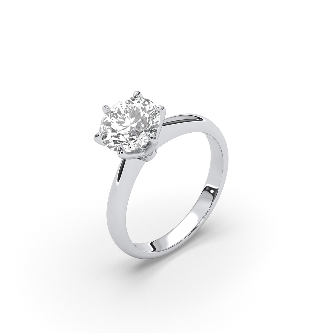 Round diamond solitaire engagement ring in 18K gold