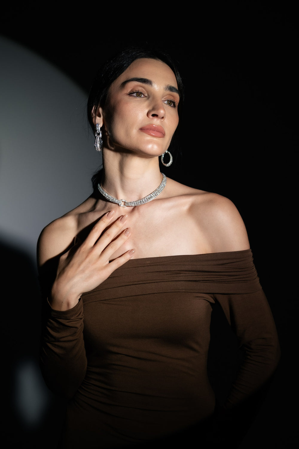 Model wearing Soit Belle white gold natural diamond choker and earrings.