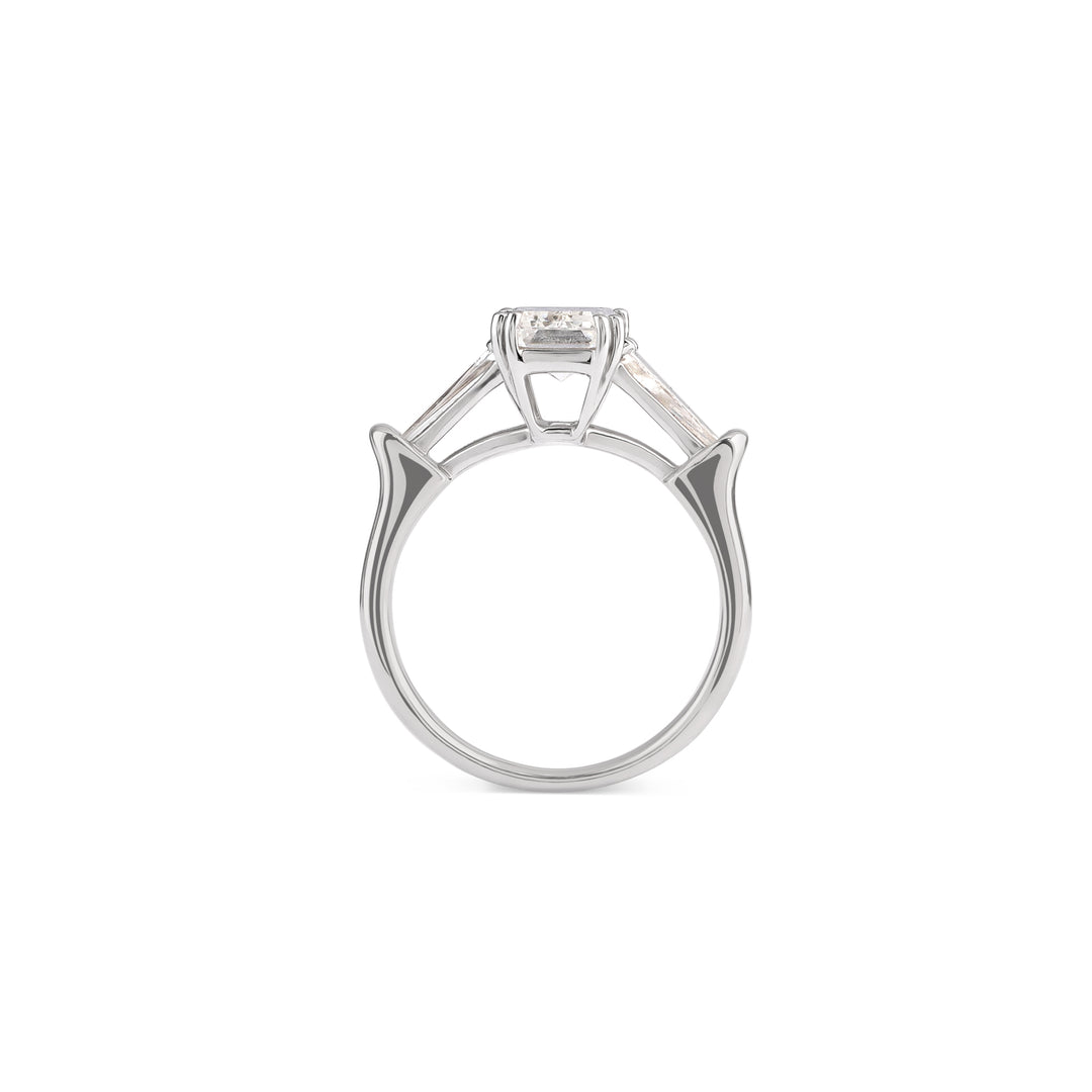 Emerald-cut three-stone diamond solitaire ring in 18K gold