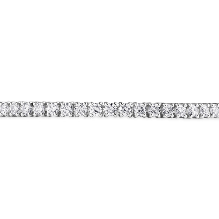 Round-cut diamond tennis bangle in 18K gold